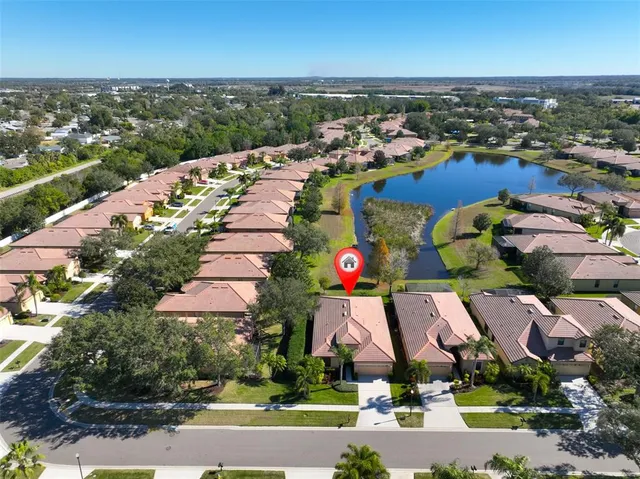 an aerial view of a houses with outdoor space