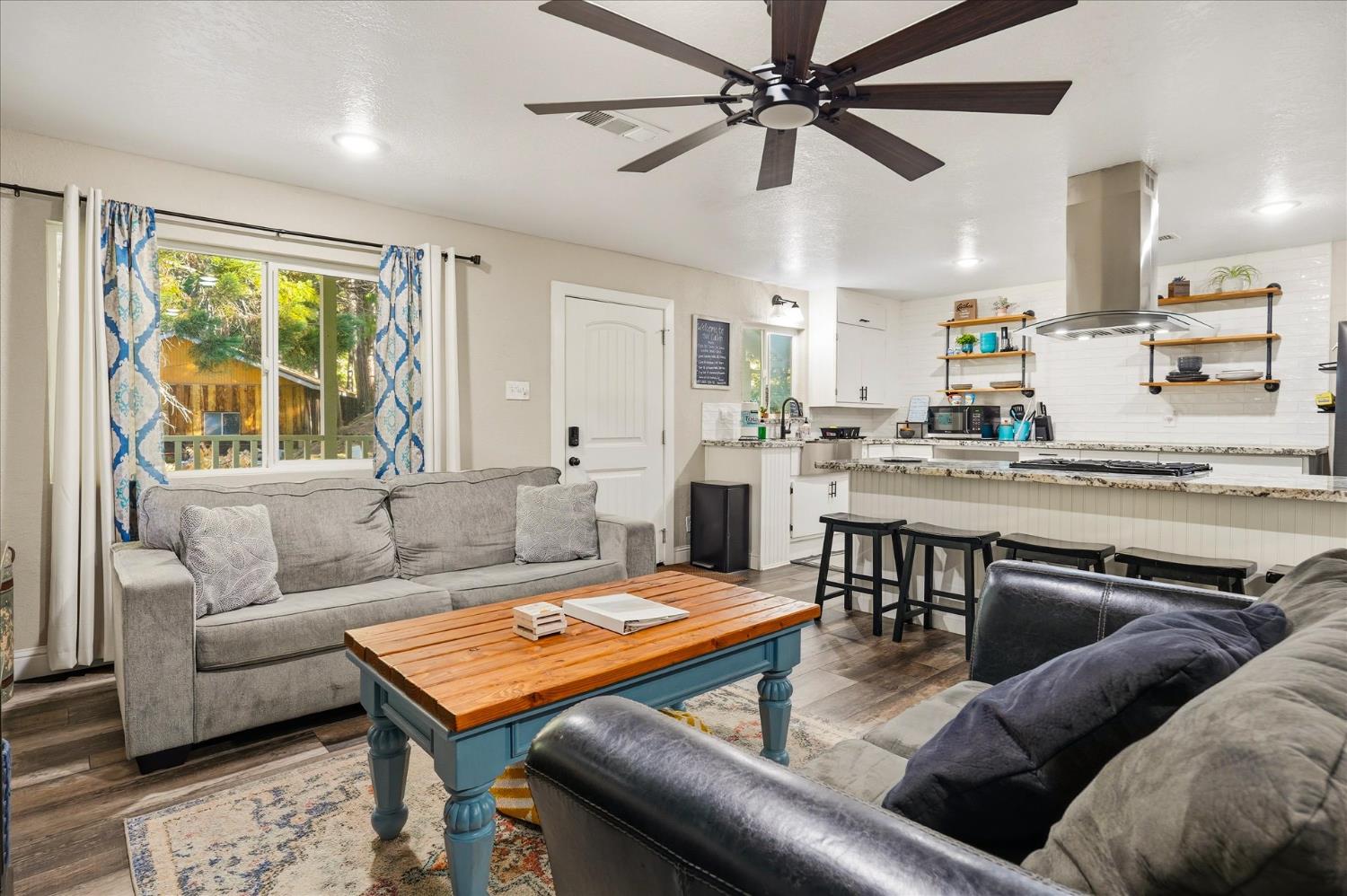 50740 Chu Ranch Road Oakhurst, CA 93644 - Photo 12 of 37 a living room with furniture and a large window