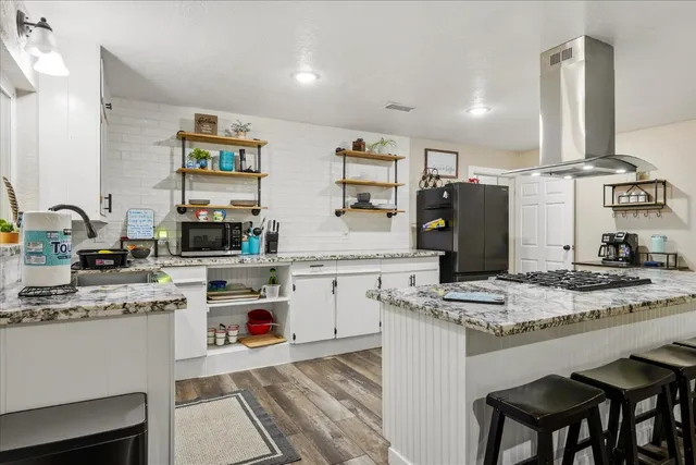 a kitchen with a stove and a microwave