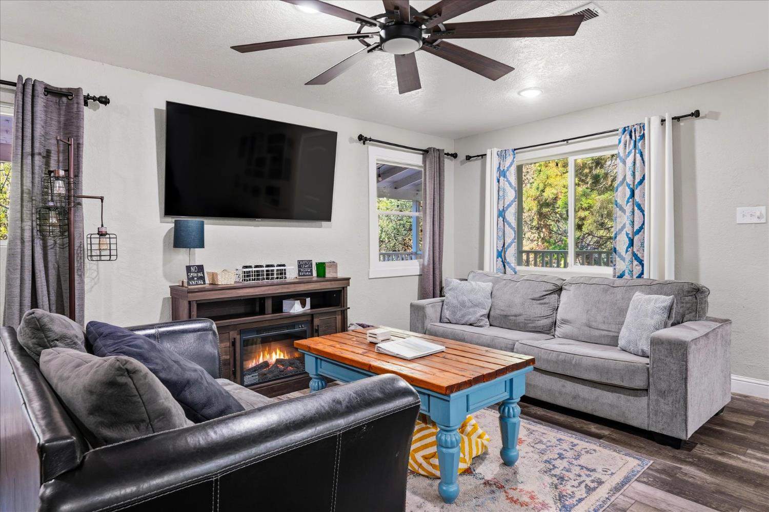 50740 Chu Ranch Road Oakhurst, CA 93644 - Photo 25 of 37 a living room with furniture and a flat screen tv