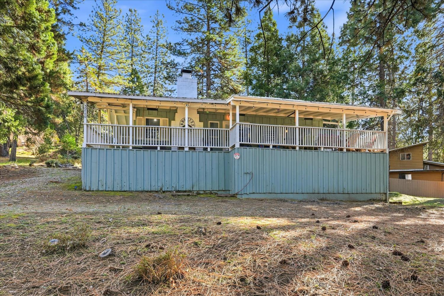 50740 Chu Ranch Road Oakhurst, CA 93644 - Photo 3 of 37 a view of a house with a yard