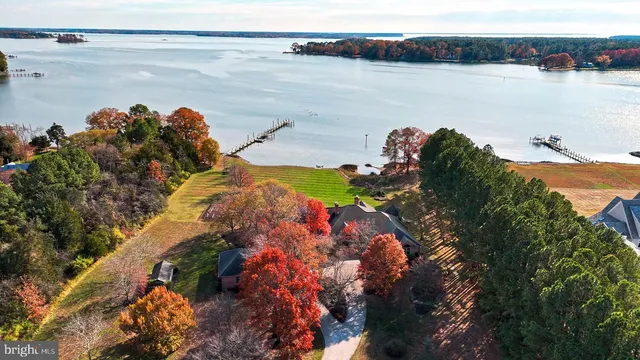 a view of a lake with houses in the back