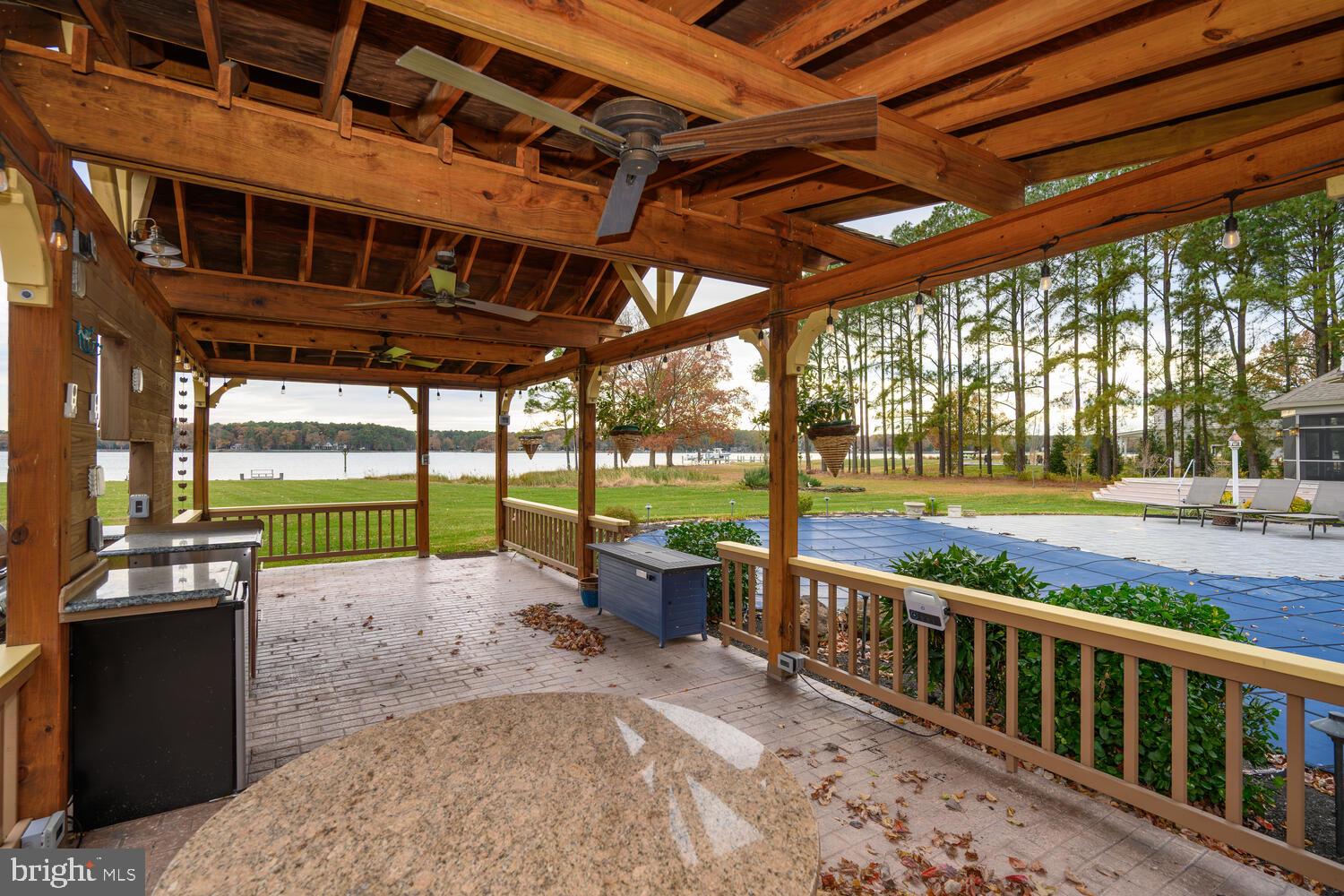 23961 Lynnewood Drive St. Michaels, MD 21663 - Photo 20 of 81 a view of a porch with a backyard