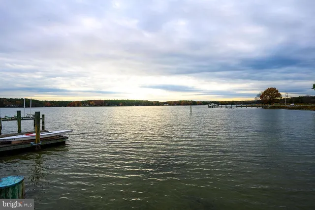 a kitchen with stainless steel appliances granite countertop a refrigerator and a stove