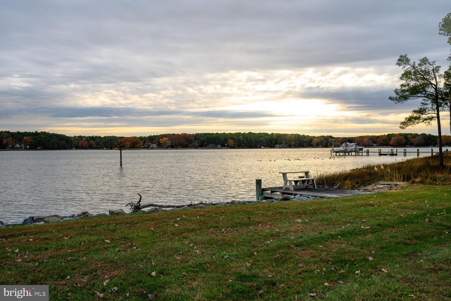 23961 Lynnewood Drive St. Michaels, MD 21663 - Photo 27 of 81 a view of a lake with houses in the back