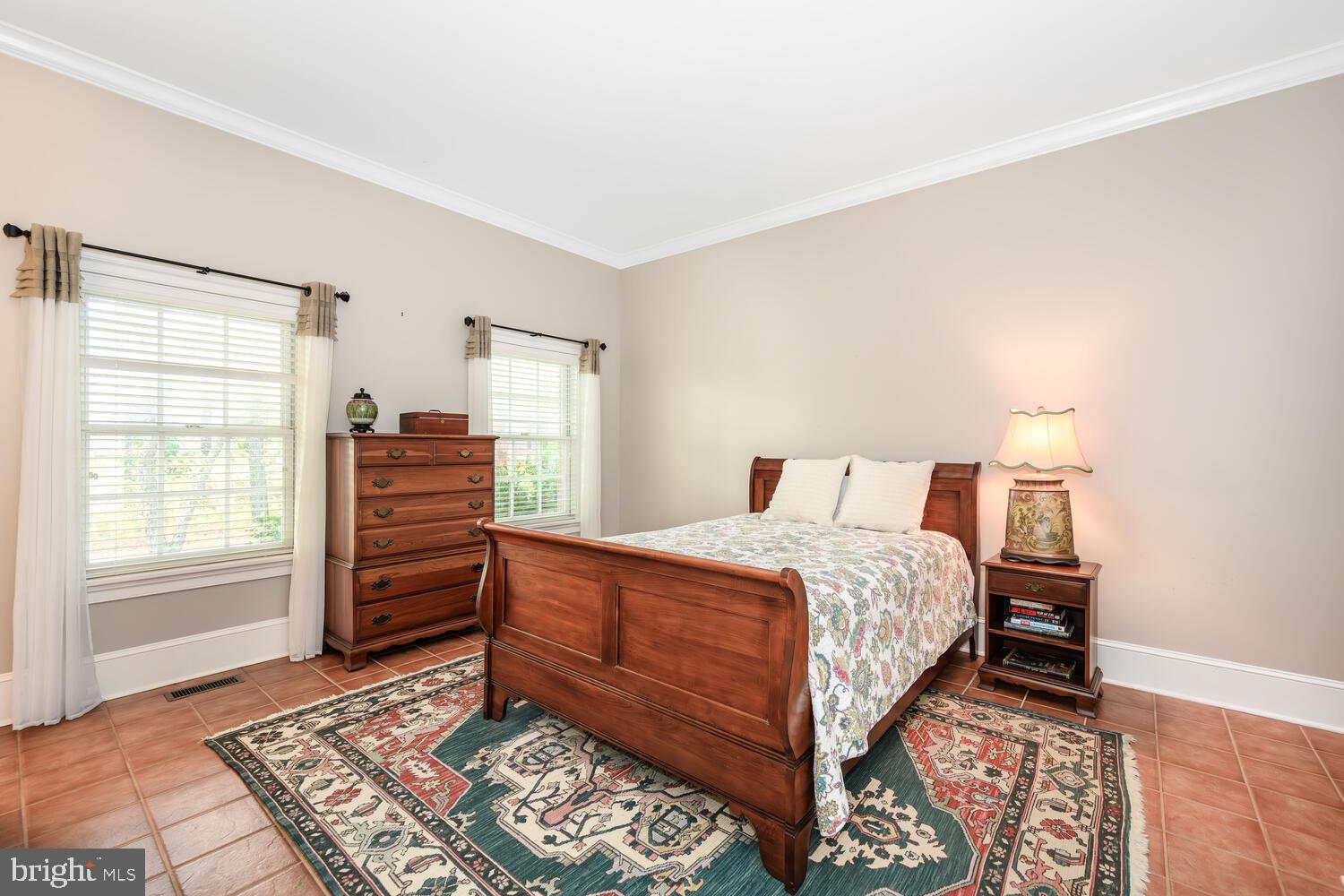 23961 Lynnewood Drive St. Michaels, MD 21663 - Photo 49 of 81 a bedroom with a bed and wooden floor