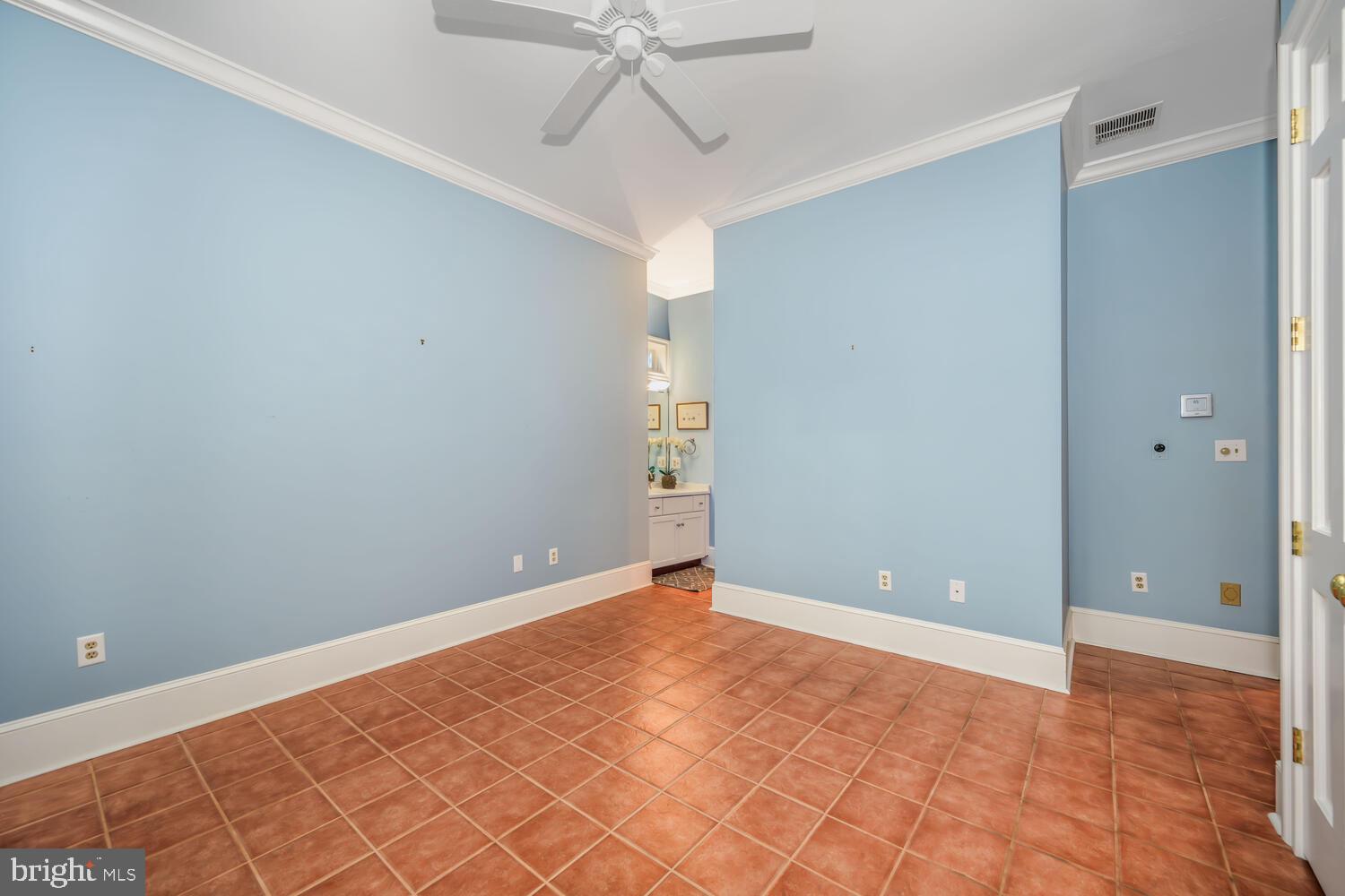 23961 Lynnewood Drive St. Michaels, MD 21663 - Photo 53 of 81 a view of an empty room with window and chandelier fan