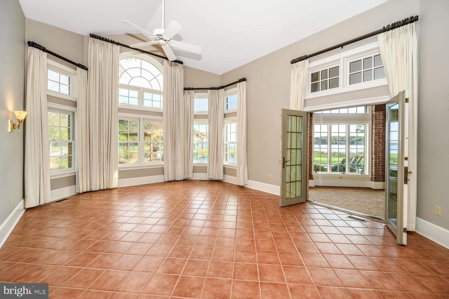 23961 Lynnewood Drive St. Michaels, MD 21663 - Photo 56 of 81 a view of an empty room with glass door
