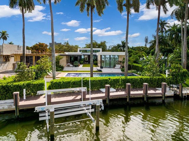 a view of a bathroom with a tub and shower