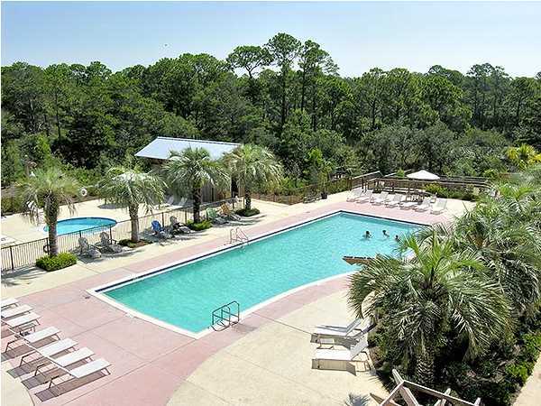 2046 Hwy Santa Rosa Beach, Unit M2321 30A Santa Rosa Beach, FL 32459 - Photo 14 of 14 a view of a swimming pool with a patio and plants