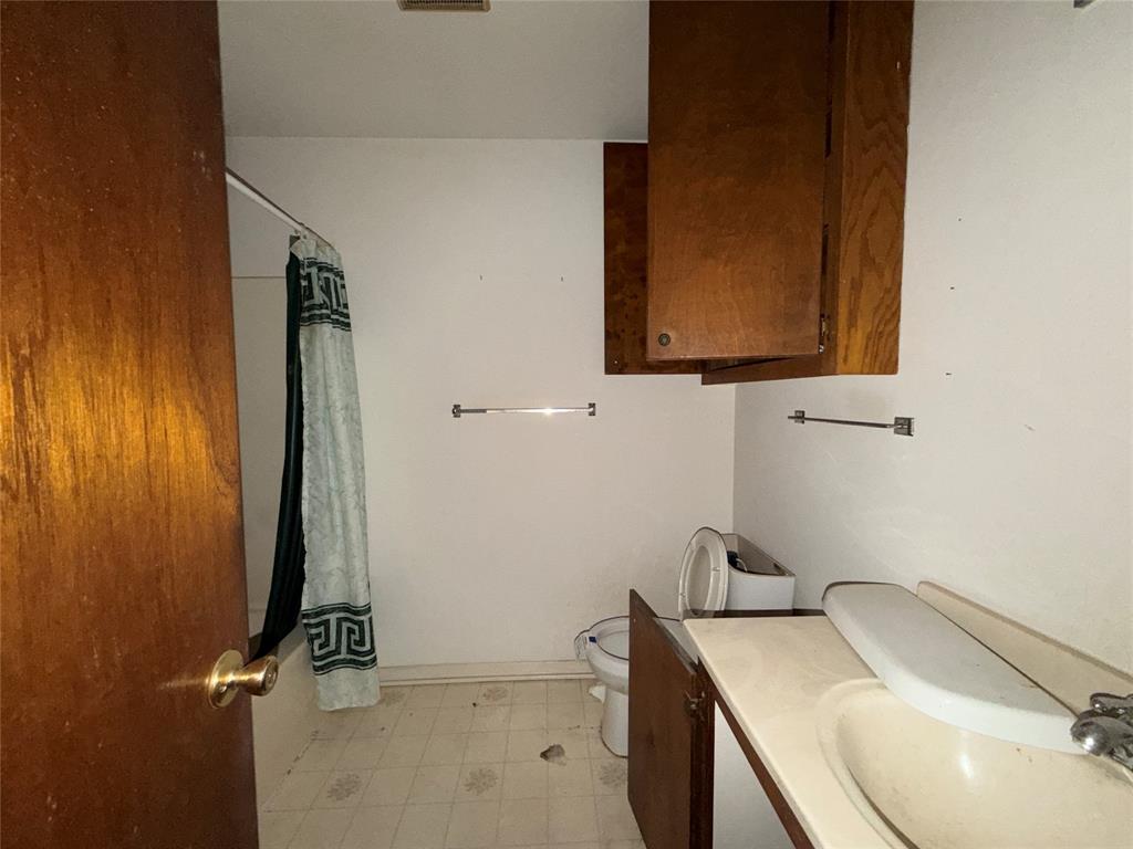 336 Butler Street Rusk, TX 75785 - Photo 25 of 27 a bathroom with a sink and a mirror