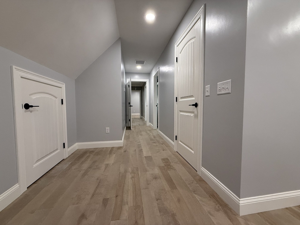 22 Cooper Road Webster, MA 01570 - Photo 26 of 42 a view of hallway with wooden floor