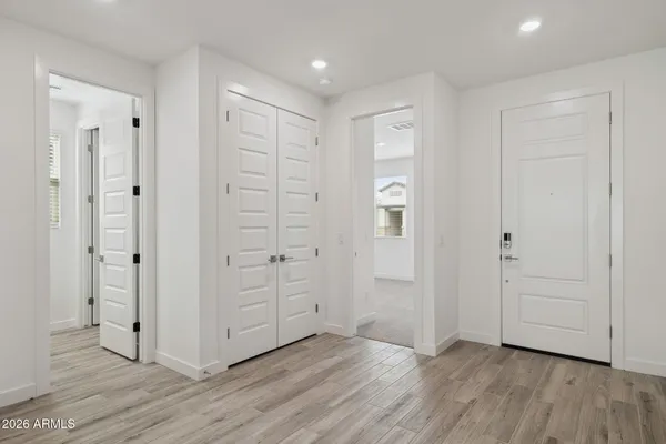 an empty room with wooden floor