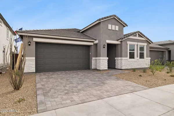 a front view of a house with a garage