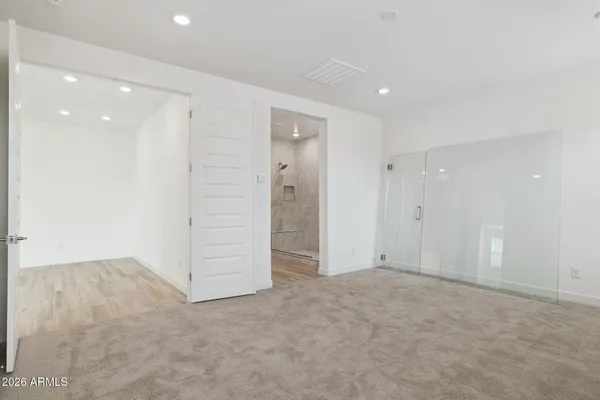 an empty room with closet area