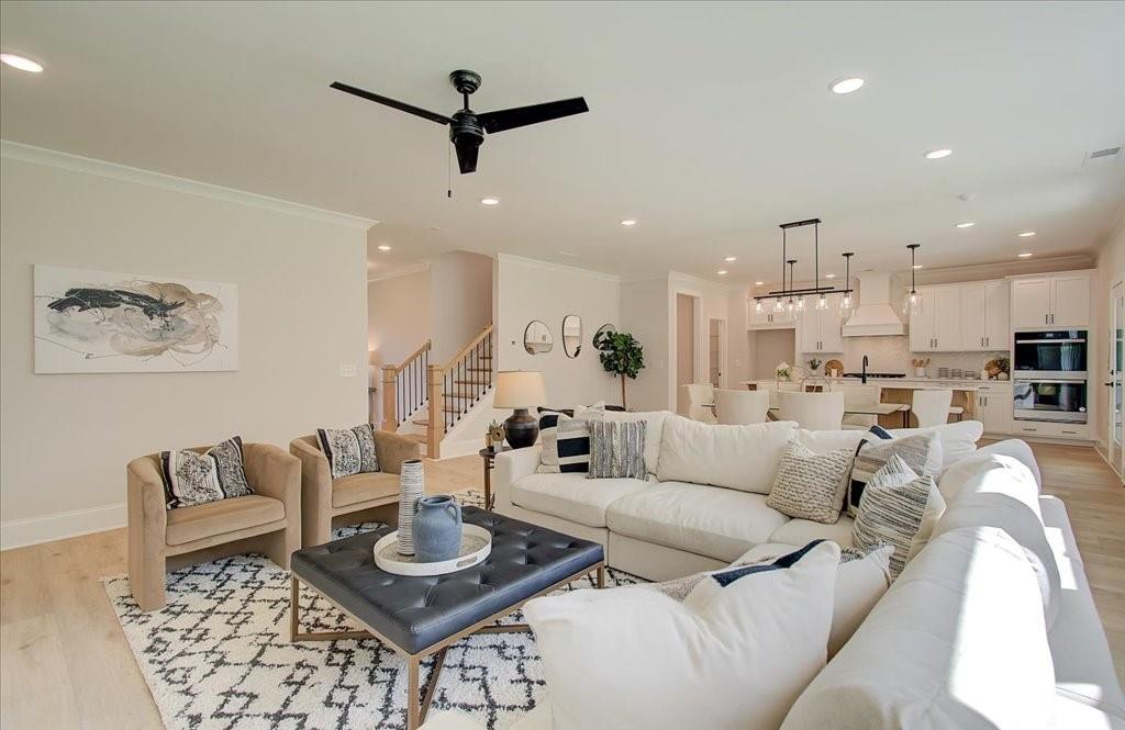 302 Evie Lane Canton, GA 30115 - Photo 13 of 45 a living room with furniture and a view of kitchen