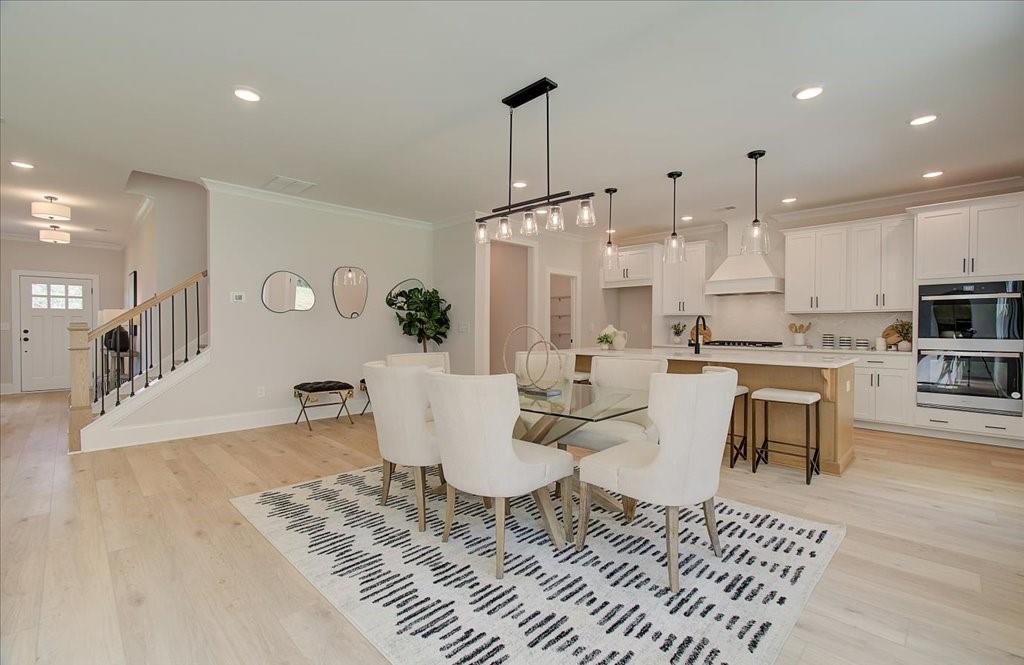302 Evie Lane Canton, GA 30115 - Photo 16 of 45 a large kitchen with a table and chairs
