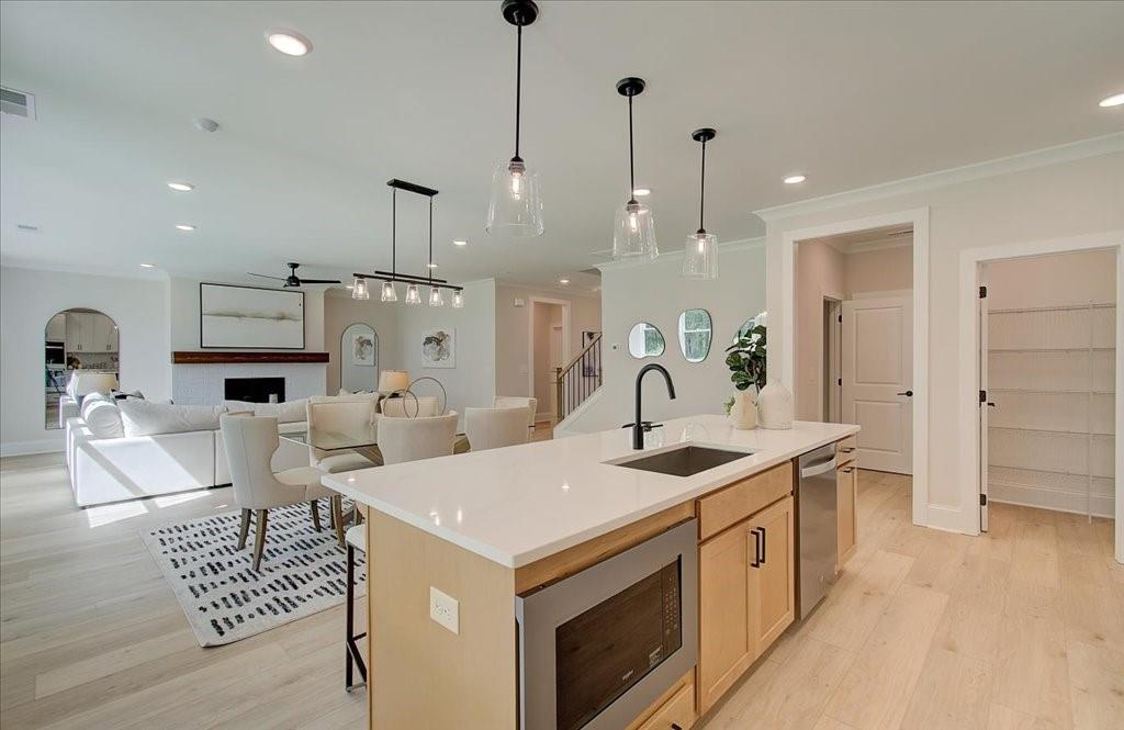 302 Evie Lane Canton, GA 30115 - Photo 20 of 45 a kitchen that has a lot of white cabinets and stainless steel appliances