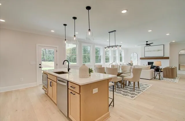 a view of a kitchen counter space and breakfast area