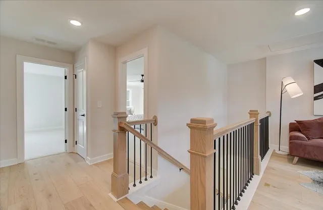 a view of a hallway with a livingroom with furniture