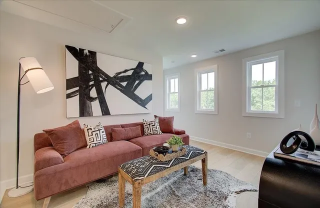 a living room with furniture and a window