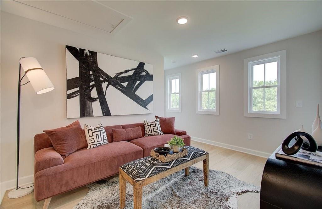 302 Evie Lane Canton, GA 30115 - Photo 24 of 45 a living room with furniture and a window
