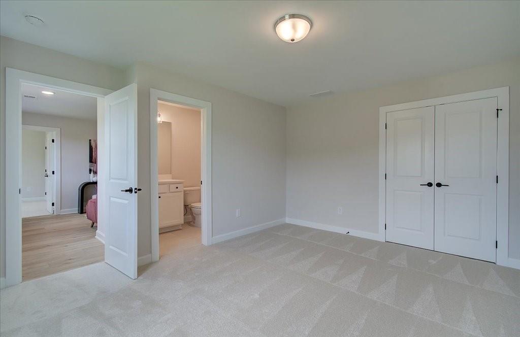 302 Evie Lane Canton, GA 30115 - Photo 27 of 45 an empty room with a hallway