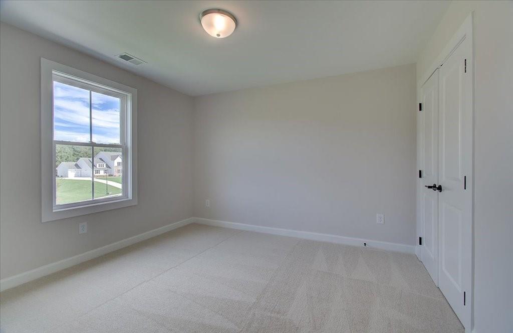 302 Evie Lane Canton, GA 30115 - Photo 29 of 45 an empty room with a window