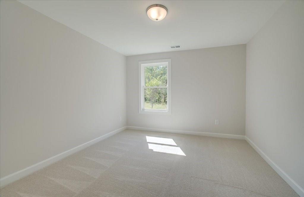 302 Evie Lane Canton, GA 30115 - Photo 32 of 45 an empty room with a window