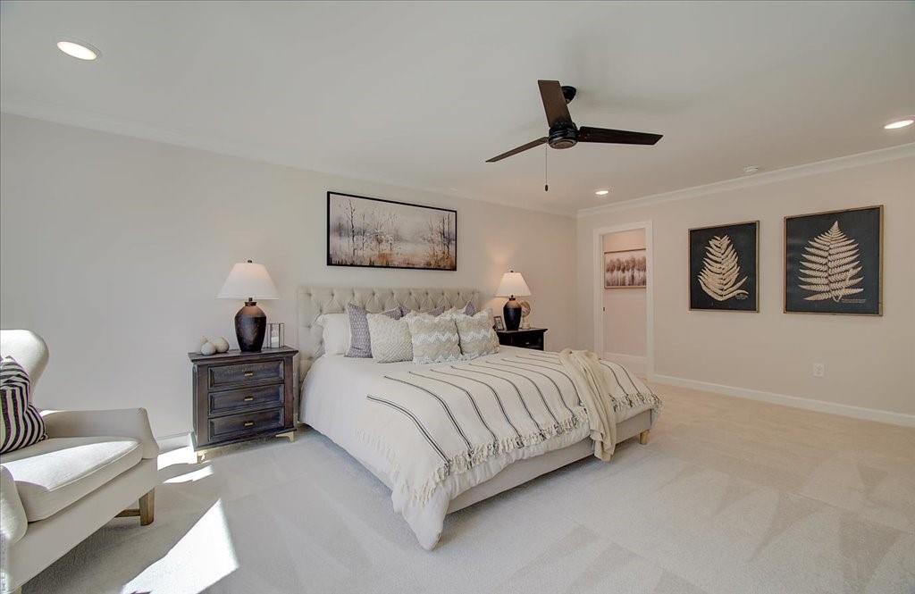 302 Evie Lane Canton, GA 30115 - Photo 34 of 45 a bedroom with a bed and a chandelier