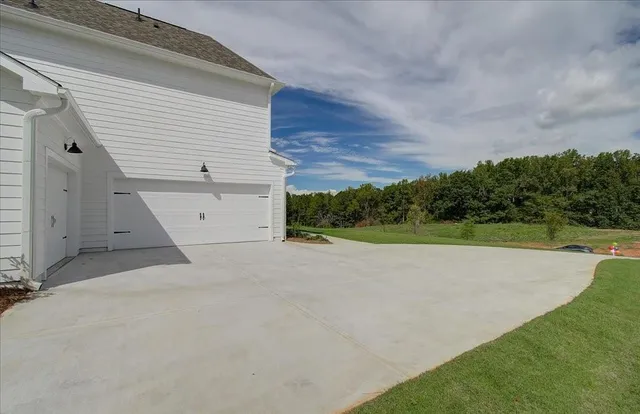 a view of a backyard of the house