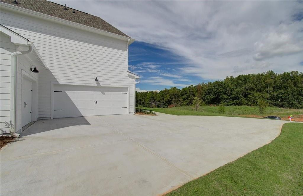 302 Evie Lane Canton, GA 30115 - Photo 6 of 45 a view of a backyard of the house