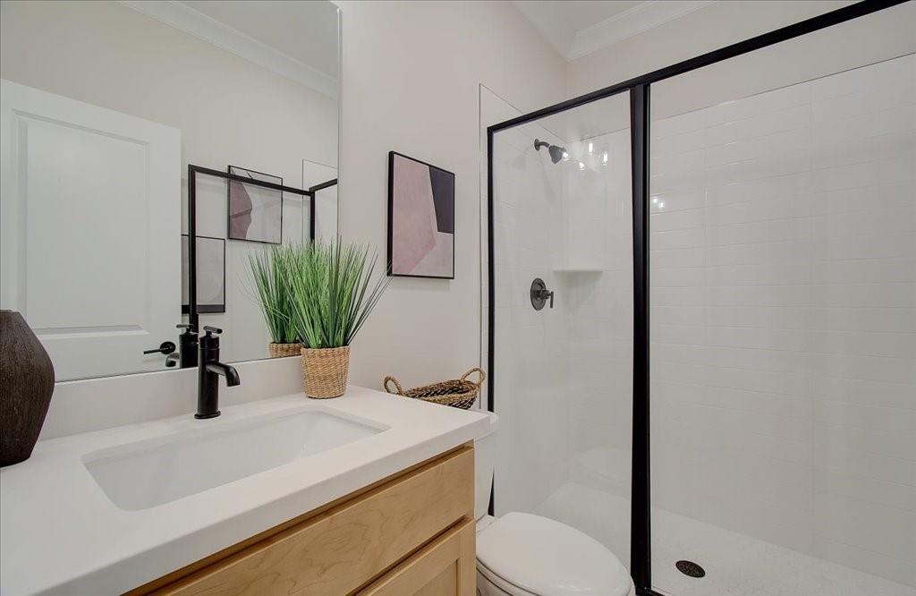 302 Evie Lane Canton, GA 30115 - Photo 9 of 45 a bathroom with a sink a toilet and a mirror