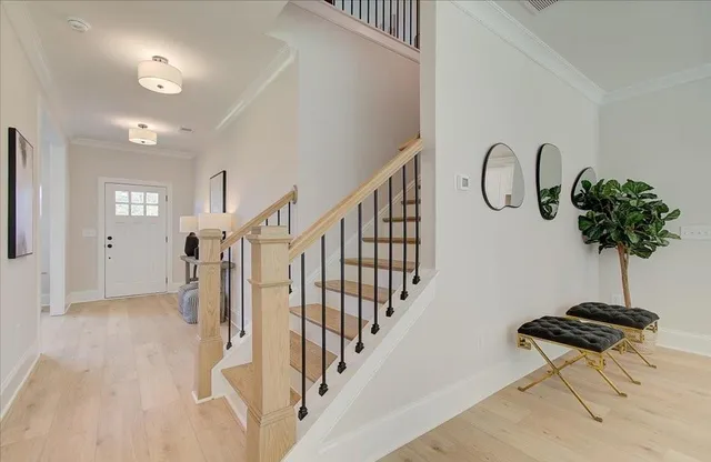 a view of entryway with a table and a potted plant