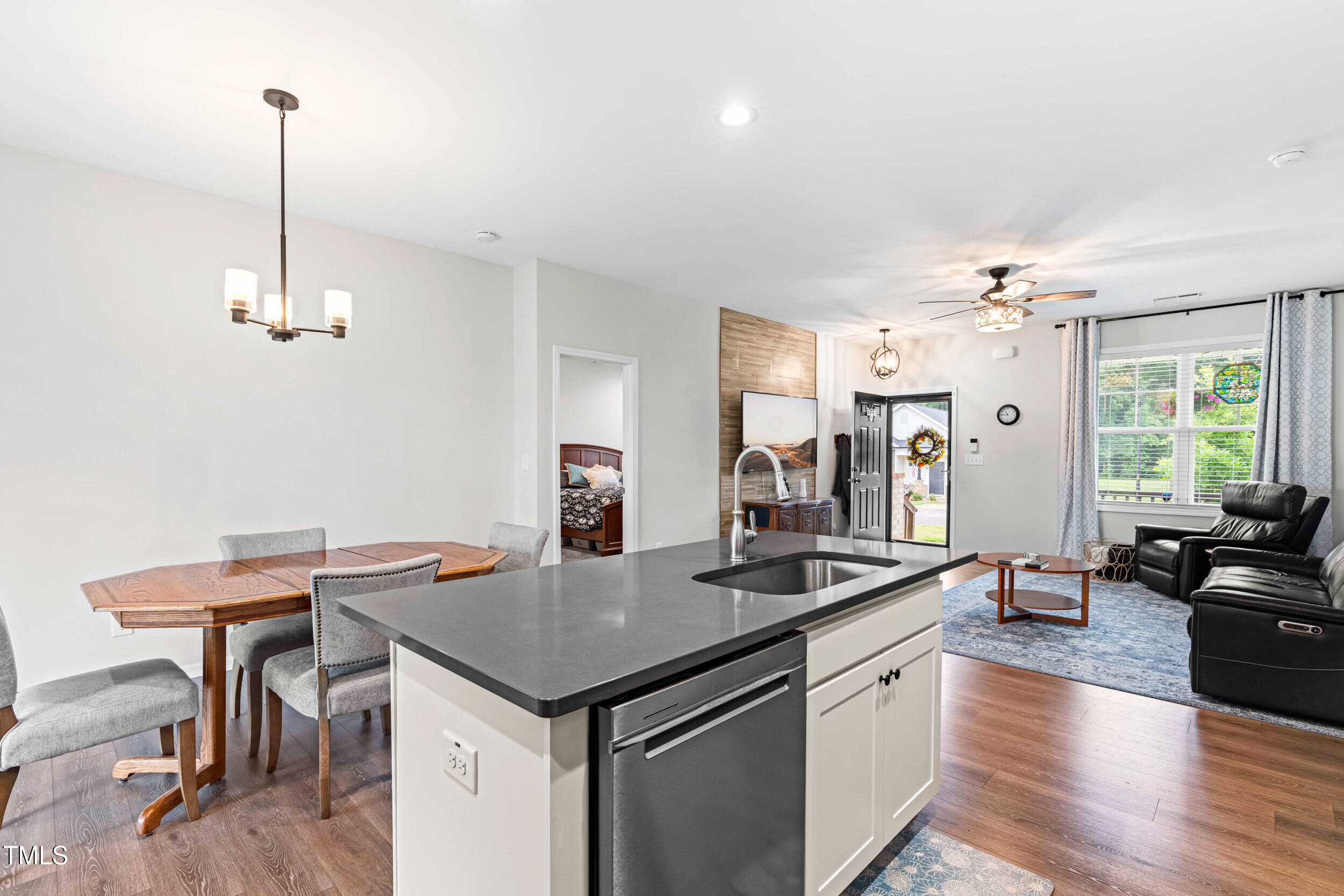 173 Longbow Drive Middlesex, NC 27557 - Photo 12 of 32 a kitchen with a counter space a sink dining table and chairs