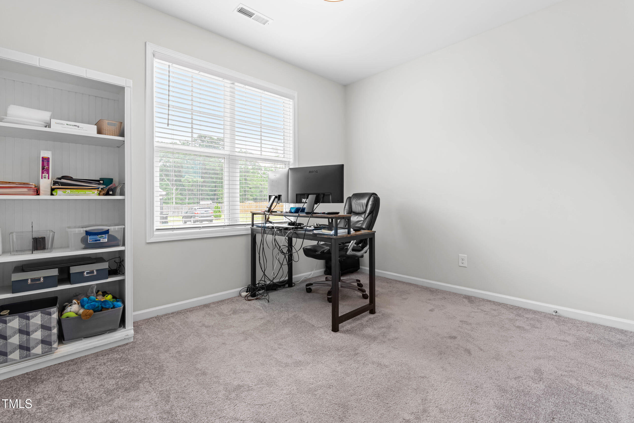 173 Longbow Drive Middlesex, NC 27557 - Photo 23 of 32 a view of a workspace with furniture and a window