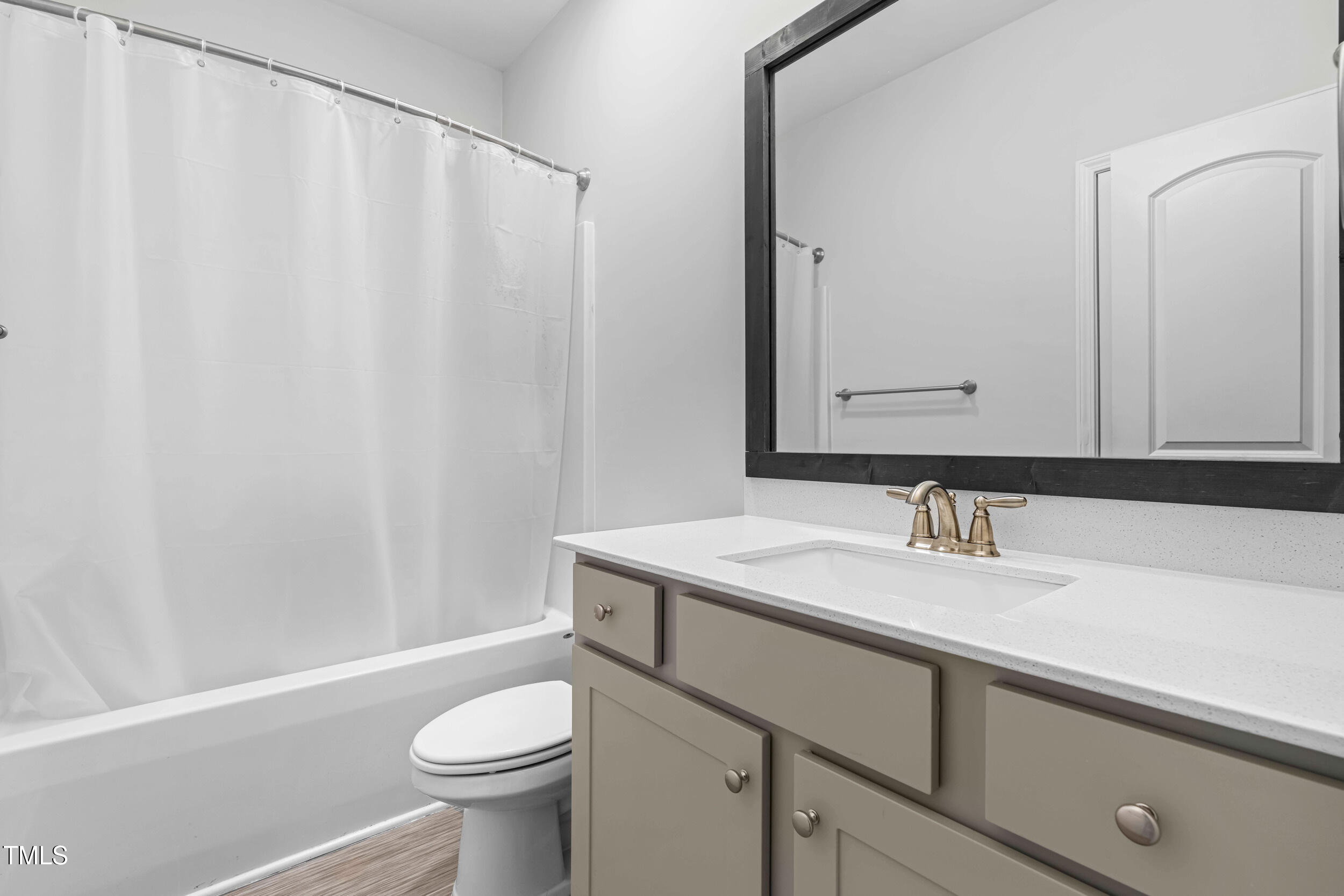 173 Longbow Drive Middlesex, NC 27557 - Photo 24 of 32 a bathroom with a sink a toilet and a mirror