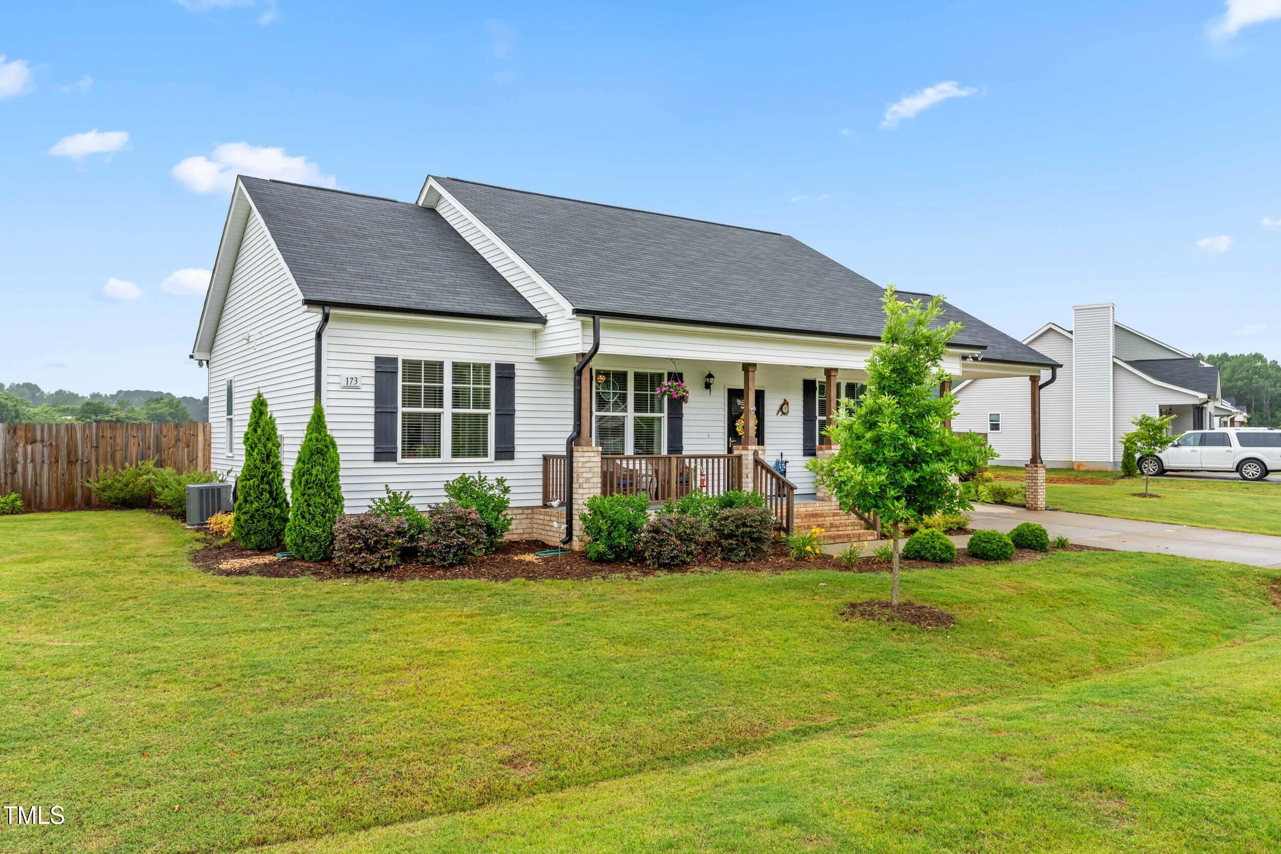 173 Longbow Drive Middlesex, NC 27557 - Photo 3 of 32 a front view of a house with a yard