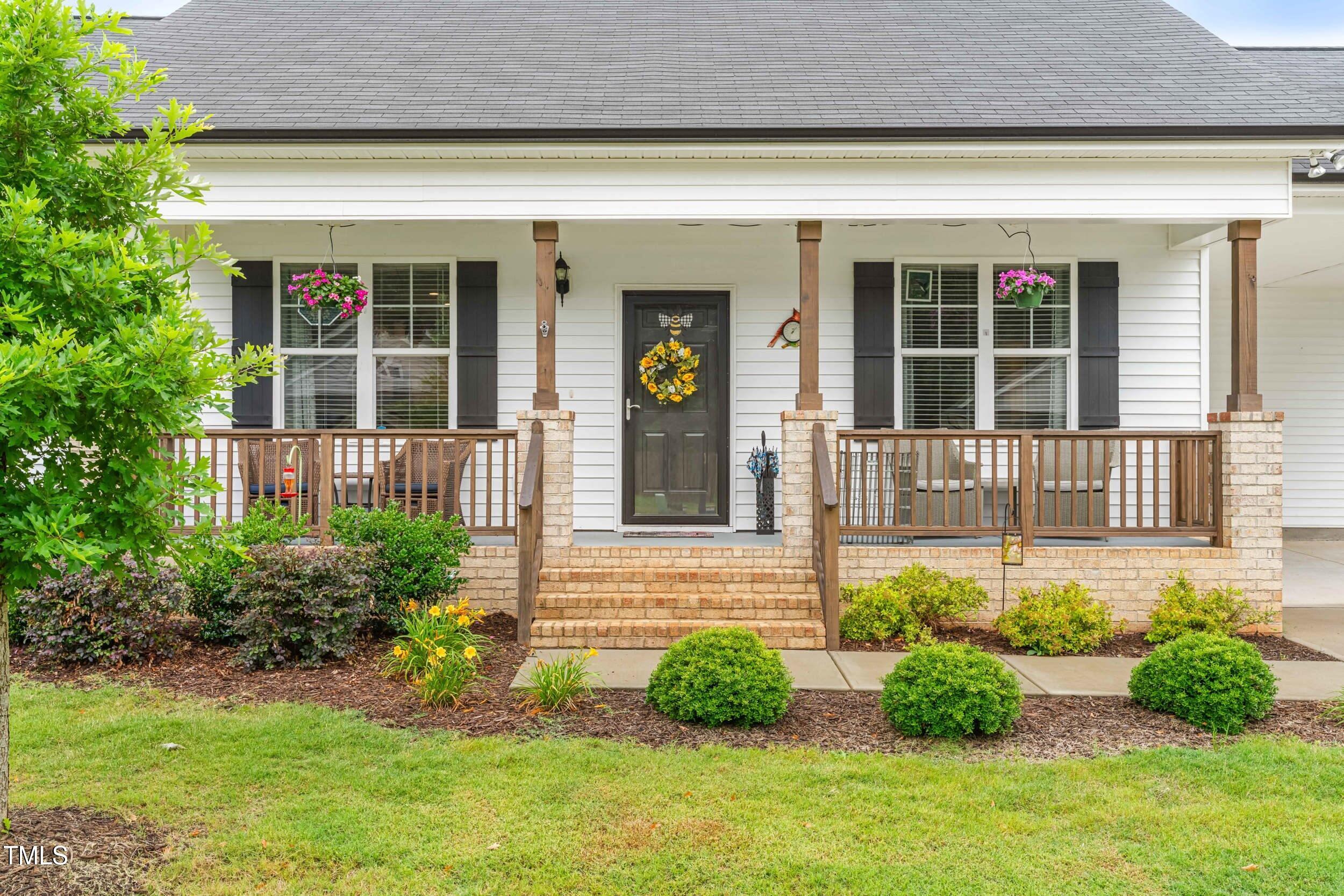 173 Longbow Drive Middlesex, NC 27557 - Photo 32 of 32 a front view of a house with garden