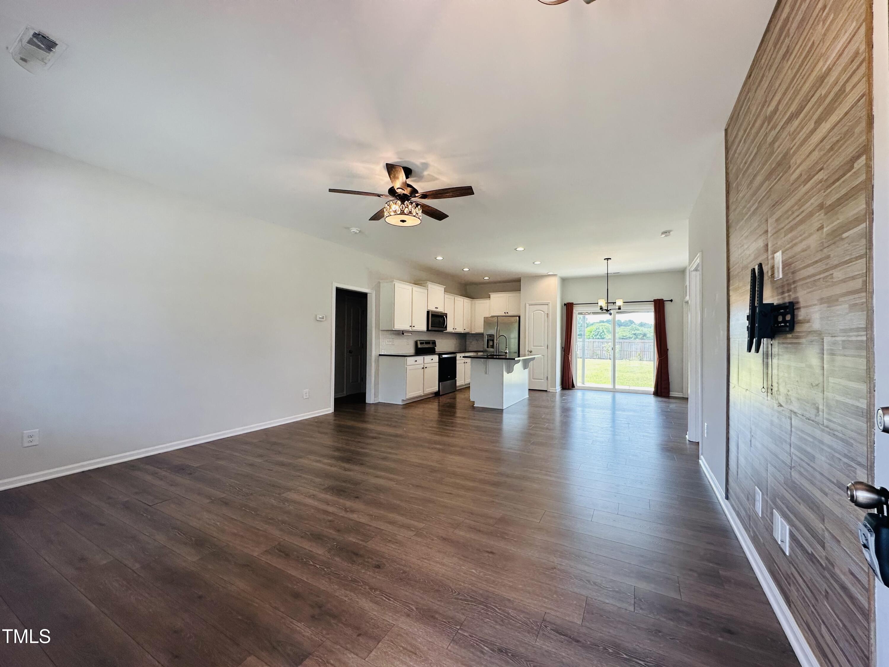 173 Longbow Drive Middlesex, NC 27557 - Photo 6 of 32 a view of a livingroom with wooden floor and a kitchen
