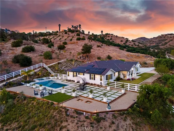an aerial view of residential houses and outdoor space