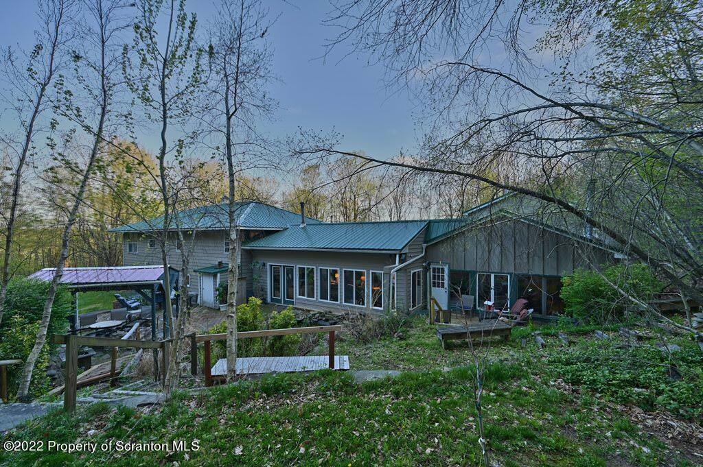 69-71 Timbertop Trail Newfoundland, PA 18445 - Photo 114 of 137 a view of a chair and table in backyard of the house