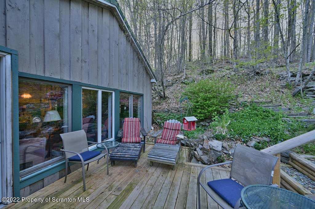 69-71 Timbertop Trail Newfoundland, PA 18445 - Photo 122 of 137 a view of a patio with couches table and chairs and potted plants