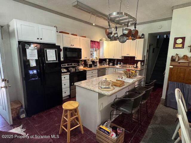 69-71 Timbertop Trail Newfoundland, PA 18445 - Photo 16 of 137 a kitchen with stainless steel appliances granite countertop a stove refrigerator and microwave