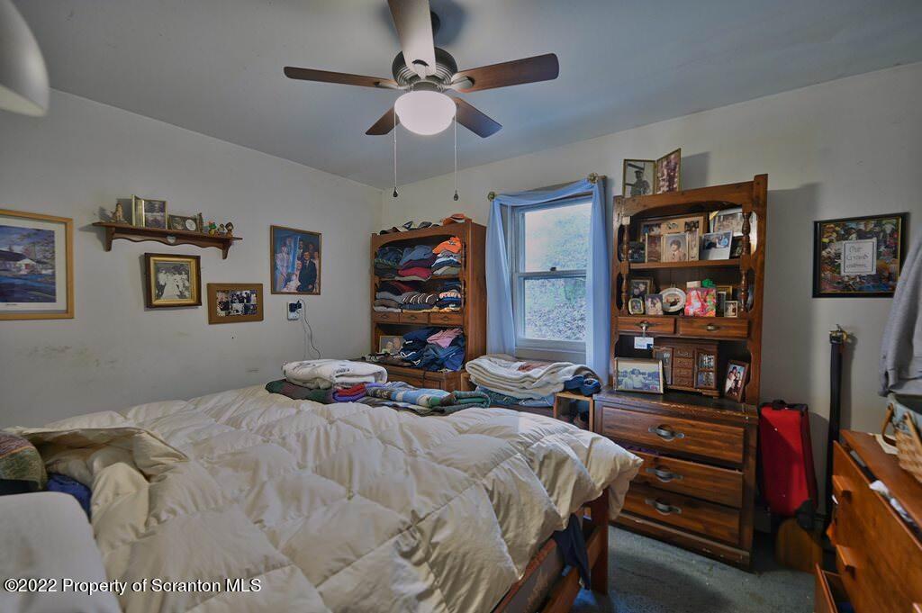 69-71 Timbertop Trail Newfoundland, PA 18445 - Photo 19 of 137 a bedroom with a bed a dresser and book shelf