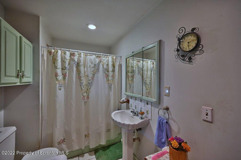 69-71 Timbertop Trail Newfoundland, PA 18445 - Photo 22 of 137 a bathroom with a sink a toilet and shower