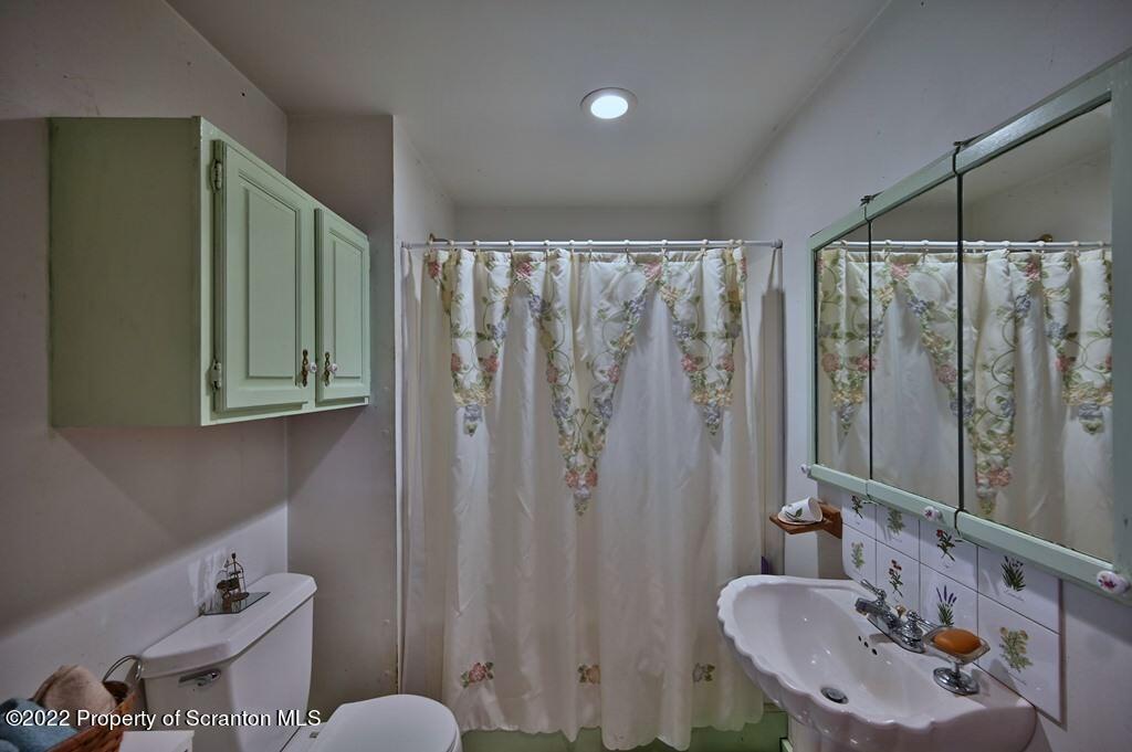 69-71 Timbertop Trail Newfoundland, PA 18445 - Photo 23 of 137 a bathroom with a sink mirror and a toilet