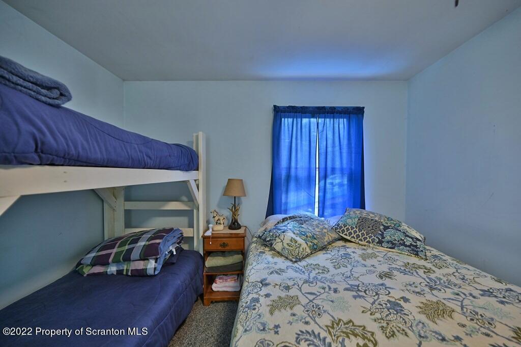 69-71 Timbertop Trail Newfoundland, PA 18445 - Photo 28 of 137 a bed room with a bed and a chair