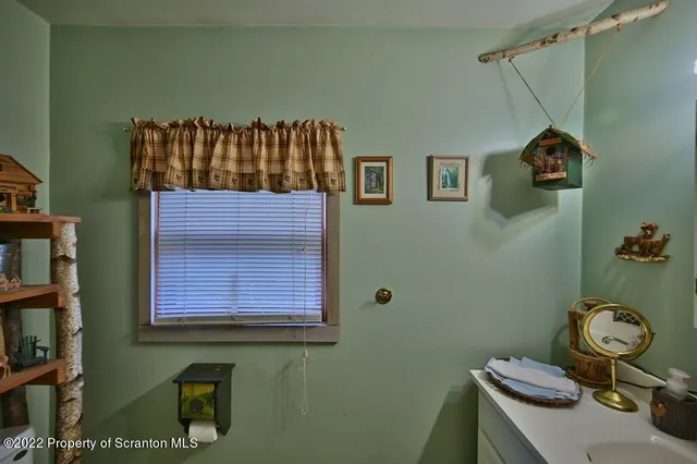 a bedroom with a large bed and a dresser