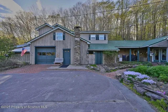 a kitchen with a sink a stove and chairs